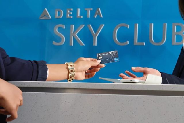 Delta SkyMiles credit card presented at Sky Club lounge counter