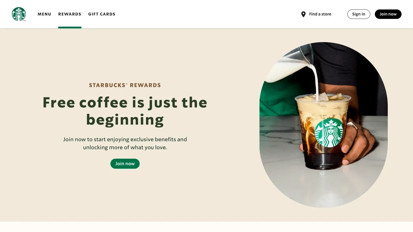 Starbucks Rewards page with the headline "Free coffee is just the beginning" and milk pouring into an iced coffee